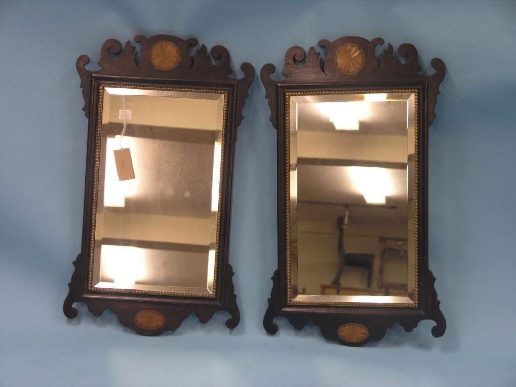 Appraisal: A pair of Georgian-style mahogany mirrors rectangular-shape each with shaped