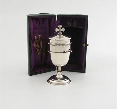 Appraisal: A silver travelling chalice and wafer box by A R