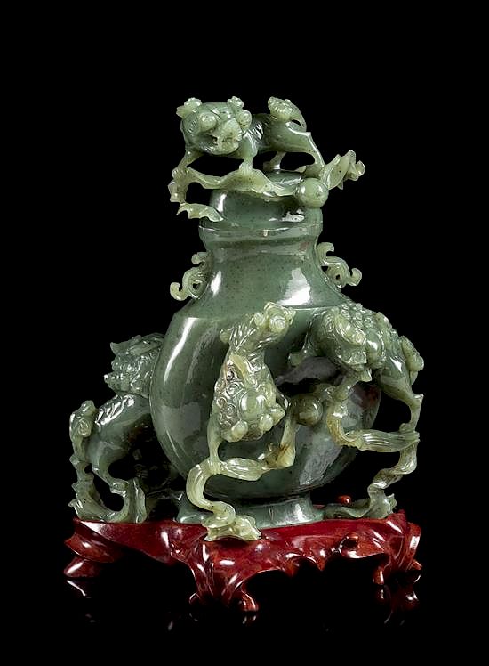 Appraisal: A Spinach Jade 'Fu Lion' Vase and Cover Height inches