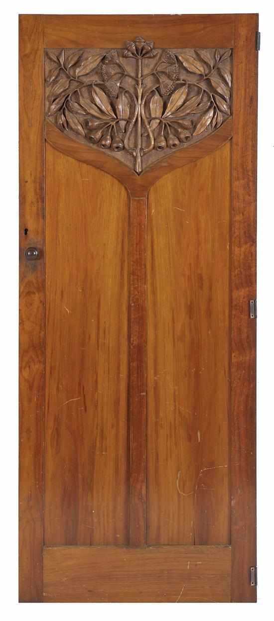 Appraisal: A CARVED AND PANELLED BLACKWOOD DOOR PANEL IN THE MANNER