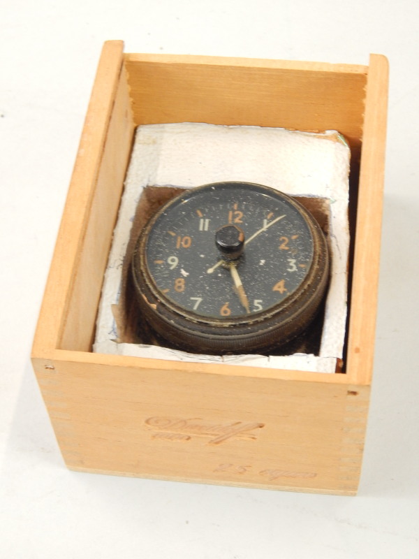 Appraisal: An aircraft clock with painted detail number to underside indistinct