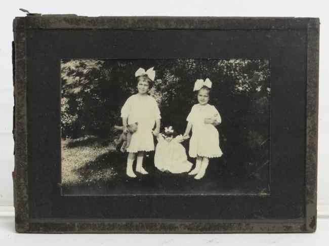 Appraisal: C - photo of children playing with teddy bear Image