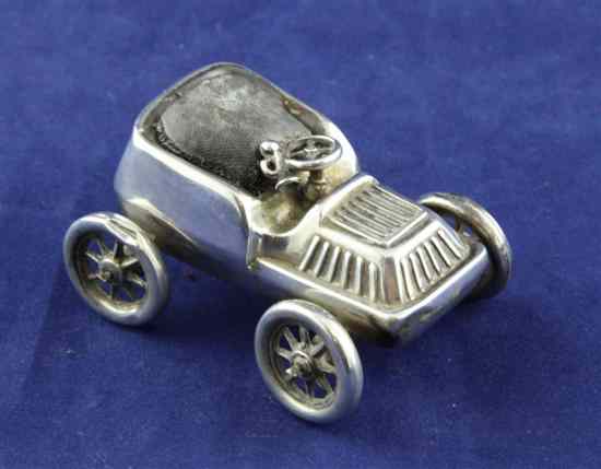 Appraisal: An Edwardian silver novelty pin cushion modelled as a motor