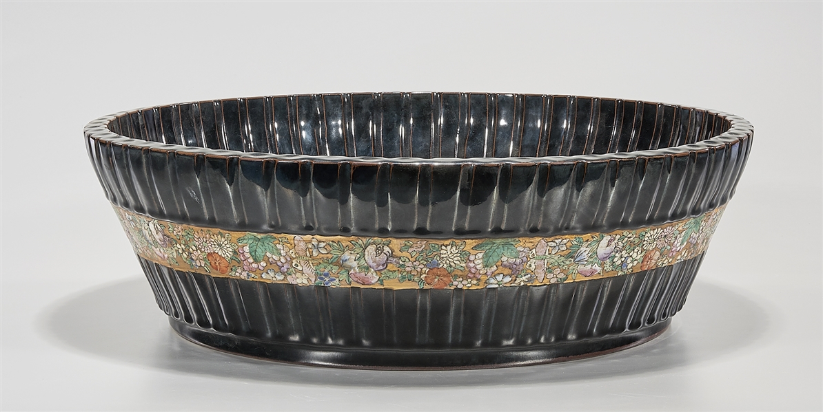 Appraisal: Chinese black glazed porcelain basin famille rose central band bamboo-form