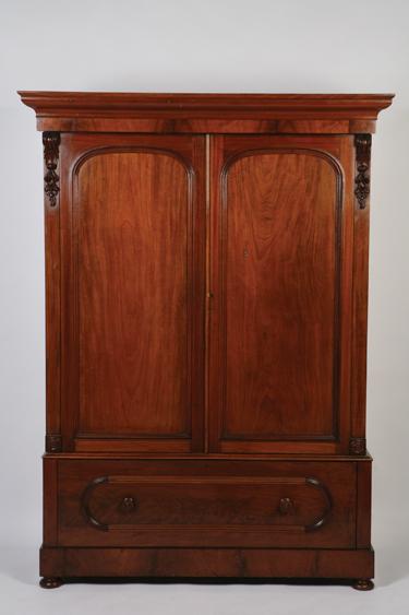 Appraisal: A VICTORIAN MAHOGANY GENTLEMAN'S WARDROBE the upper section with arched