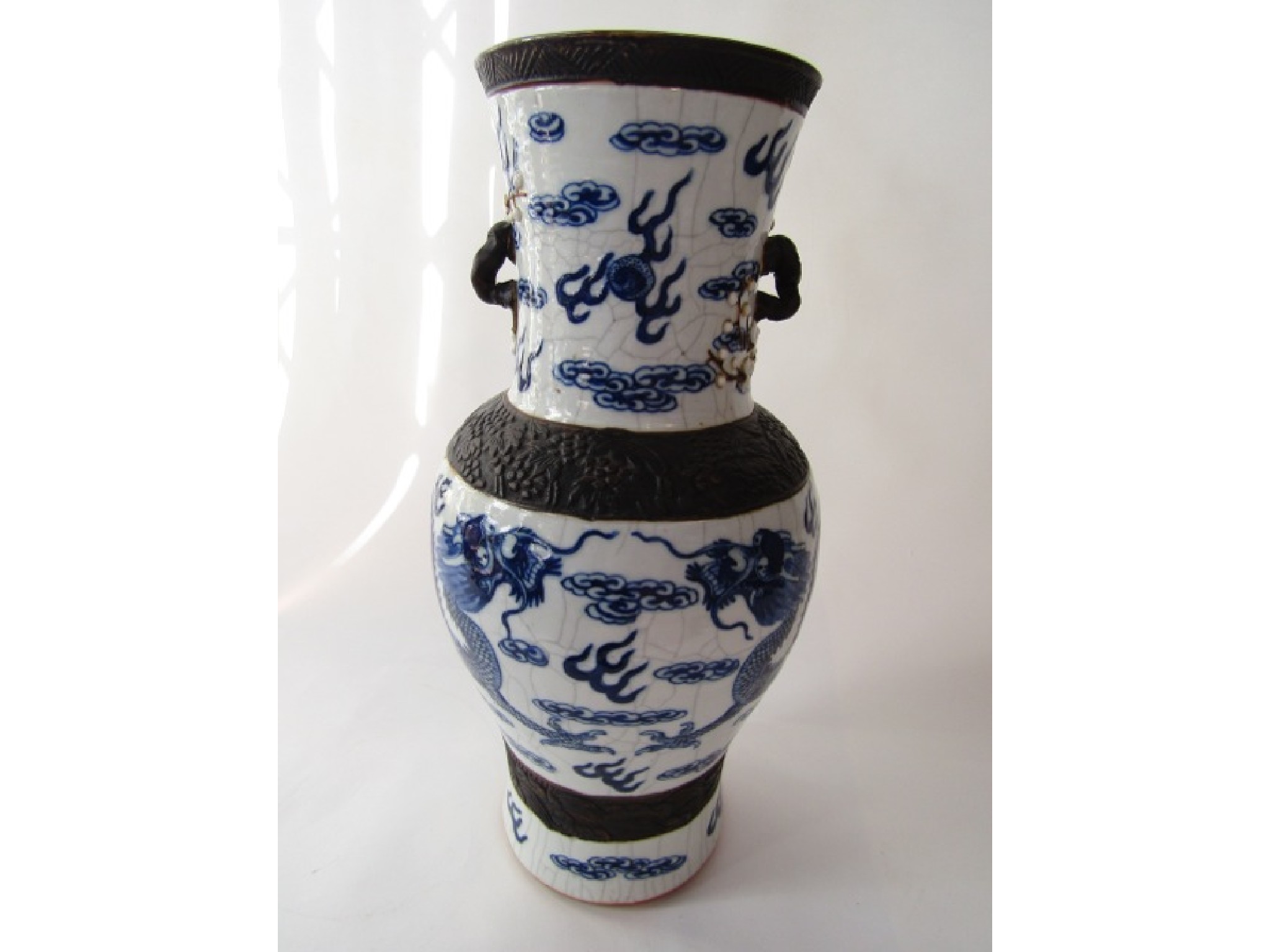 Appraisal: A Chinese crackle glazed baluster shaped vase with dragon cloud