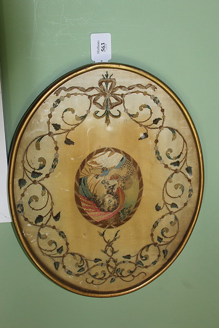 Appraisal: A GEORGIAN SILK AND EMBROIDERED OVAL PANEL of mother and