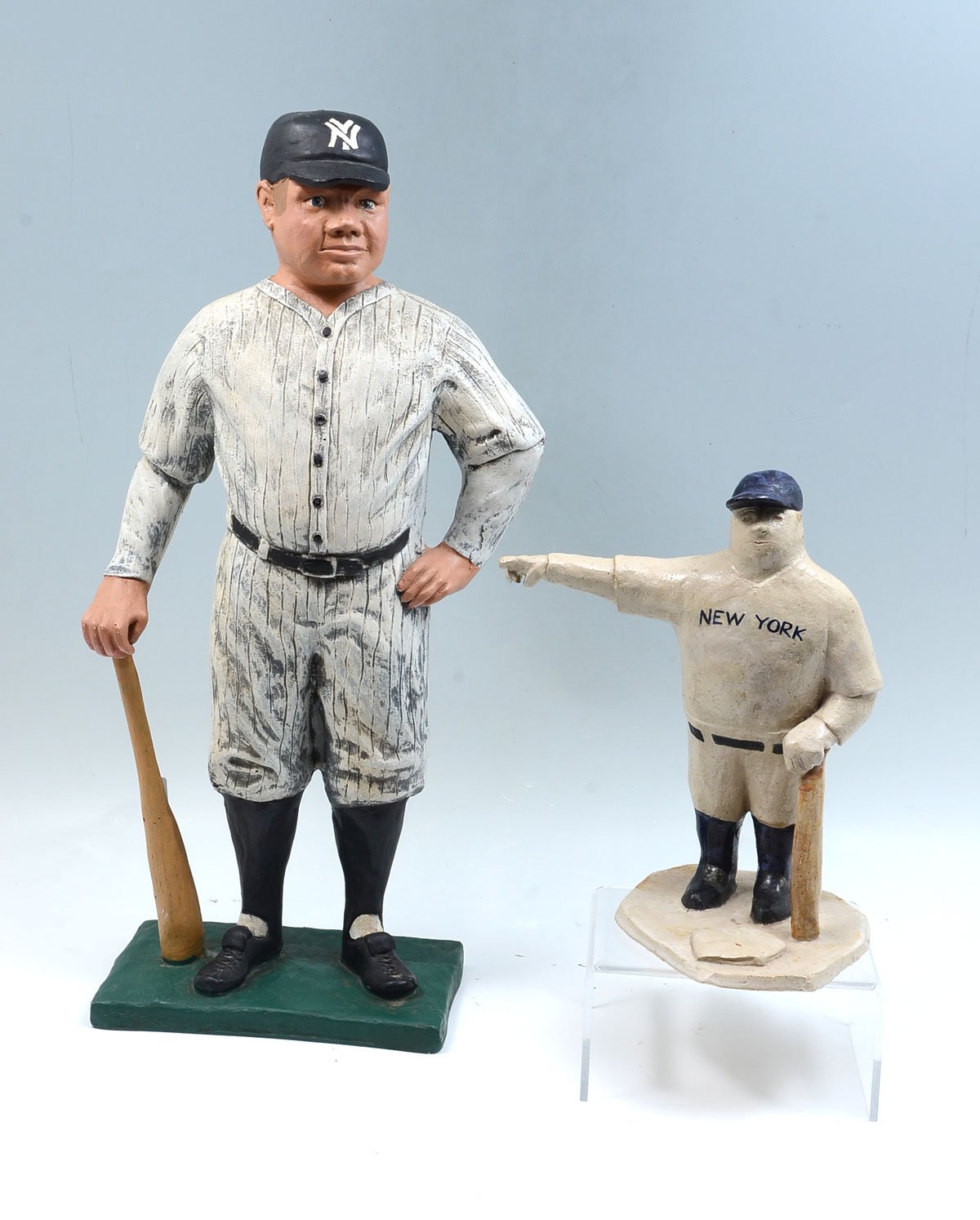 Appraisal: TWO BABE RUTH SCULPTURES Unsigned glazed pottery sculpture of the