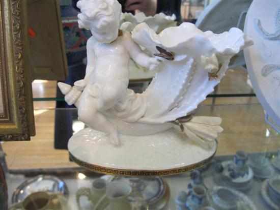 Appraisal: MOORE BROS CHERUB ADORNED VASE ALL FAULTS