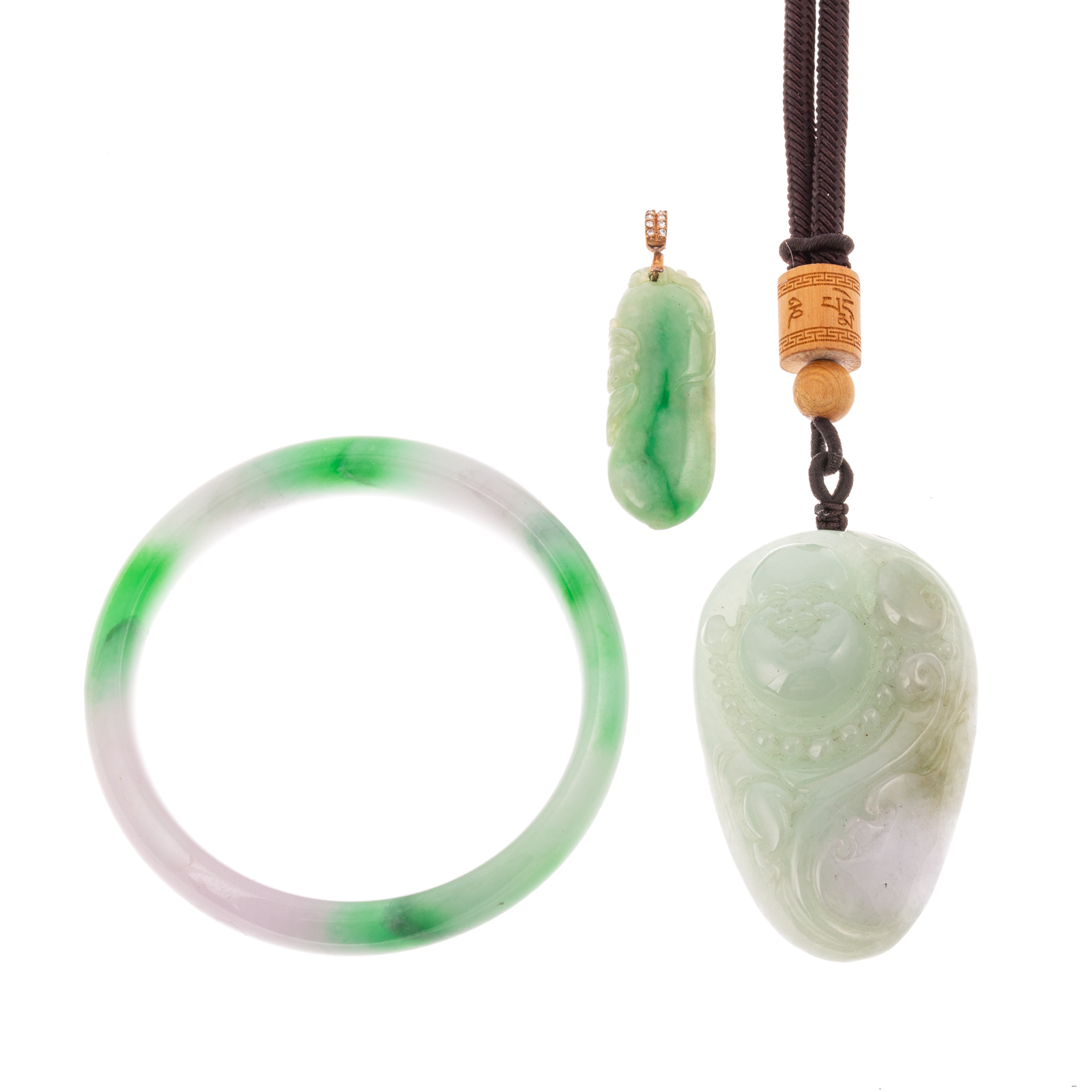 Appraisal: A COLLECTION OF CHINESE JADE JEWELRY Collection includes round jade