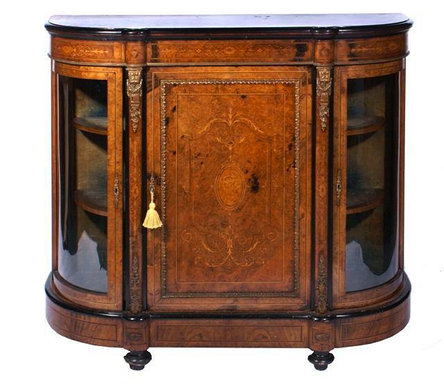 Appraisal: A VICTORIAN WALNUT AND INLAID CREDENZA with gilt metal mount