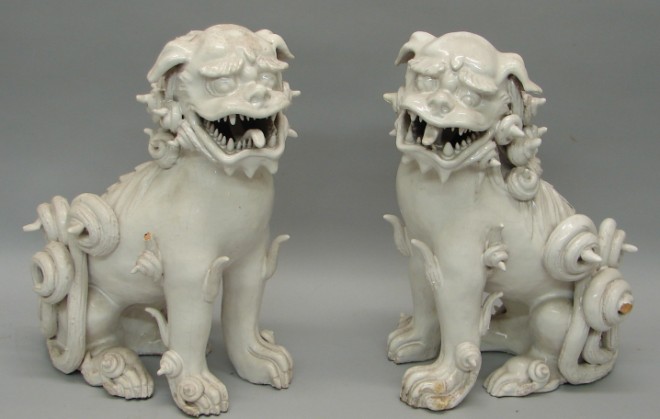 Appraisal: Two foo dogs with white glaze t x l loss