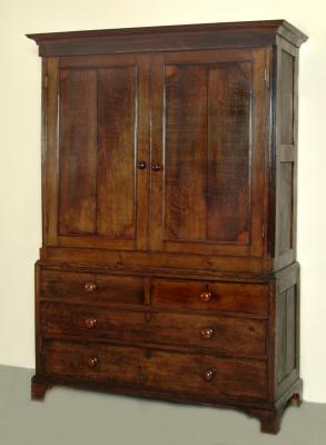 Appraisal: AN OAK PRESS CUPBOARD the moulded cornice over two panelled