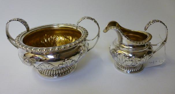 Appraisal: A LATE GEORGE III SUGAR BASIN AND MATCHING MILK JUG