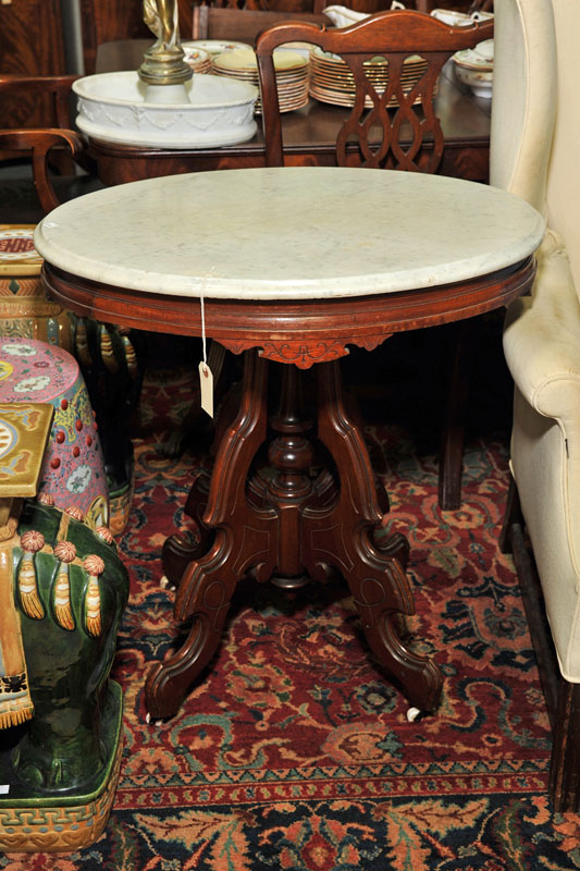 Appraisal: VICTORIAN MARBLE TOP TABLE Walnut having an oval top on