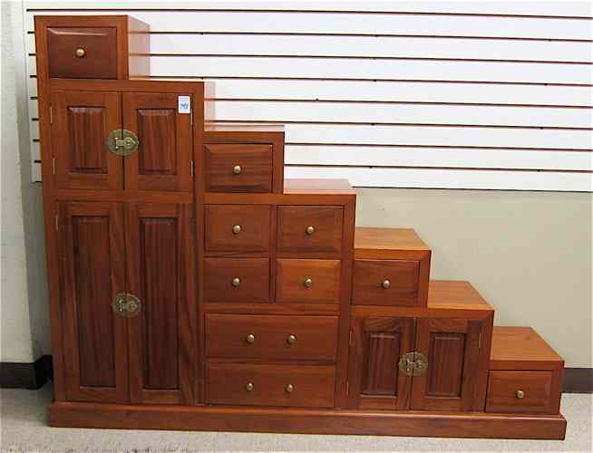 Appraisal: TEAKWOOD STAIR-STEP CHEST Chinese th century one side featuring drawers