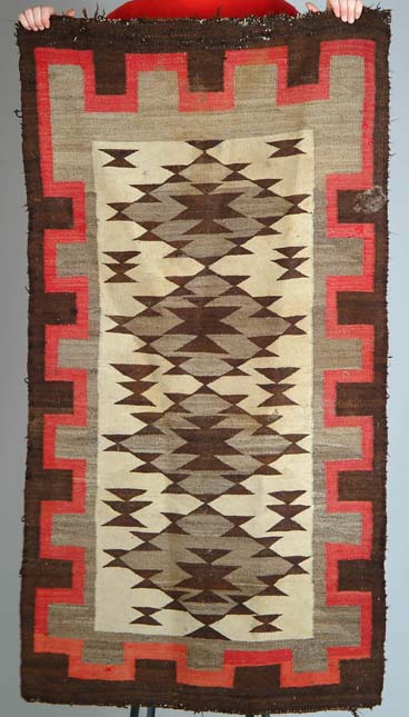 Appraisal: OLD NAVAJO RUG Center field with four medallions on an