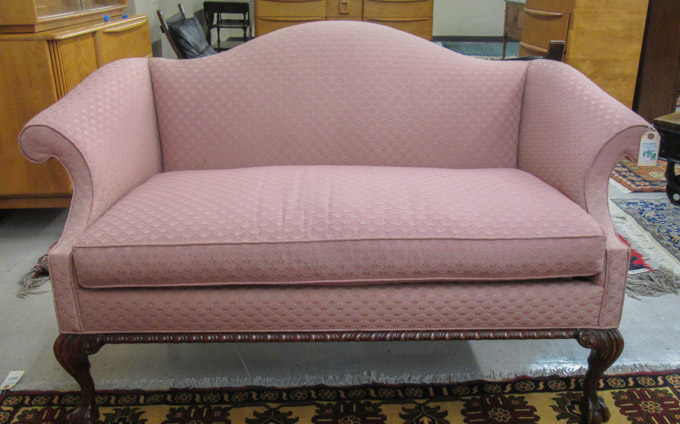 Appraisal: CHIPPENDALE STYLE SETTEE a camel-back scroll-arm design with rose upholstery