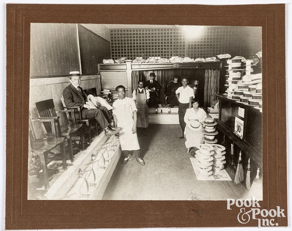 Appraisal: Photograph of a shoe shine and hat shop Photograph of