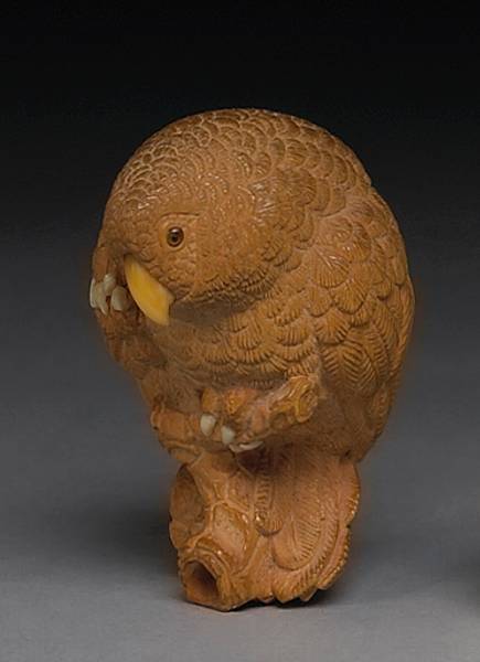 Appraisal: A carved wood netsuke study of an owl By Bishu