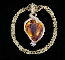 Appraisal: A Magnificent Henry Dunay Orange Garnet Diamonds Cameo Necklace This