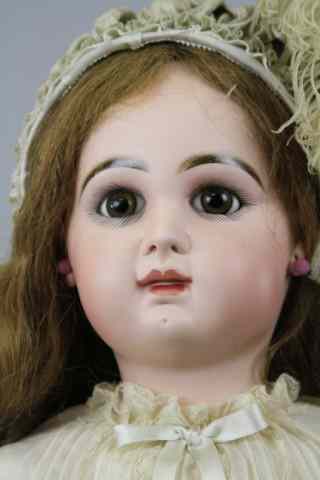 Appraisal: LARGE TETE JUMEAU BEBE Wide eyed doll with brown paperweight