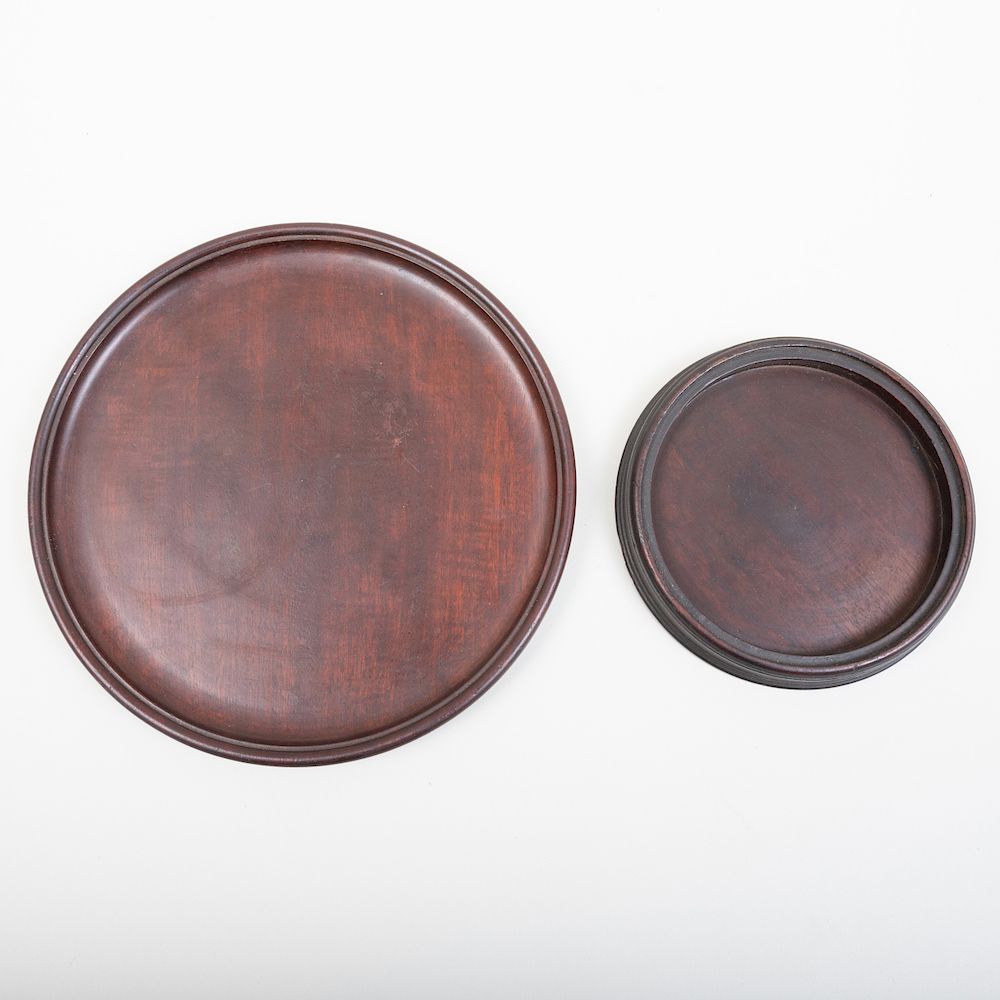 Appraisal: Two Mahogany Trays The larger in diam Property From the