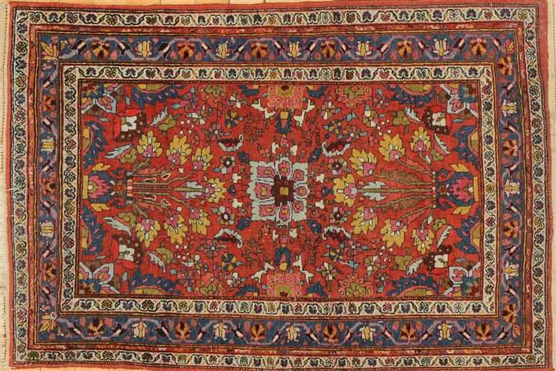 Appraisal: PERSIAN TERRACOTTA-GROUND RUG Worked with flowers-in-urns within blue meander primary