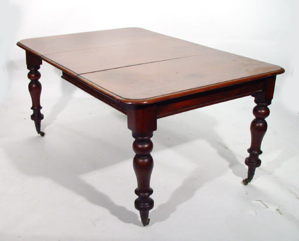 Appraisal: Victorian mahogany extending dining table with one extra leaf on