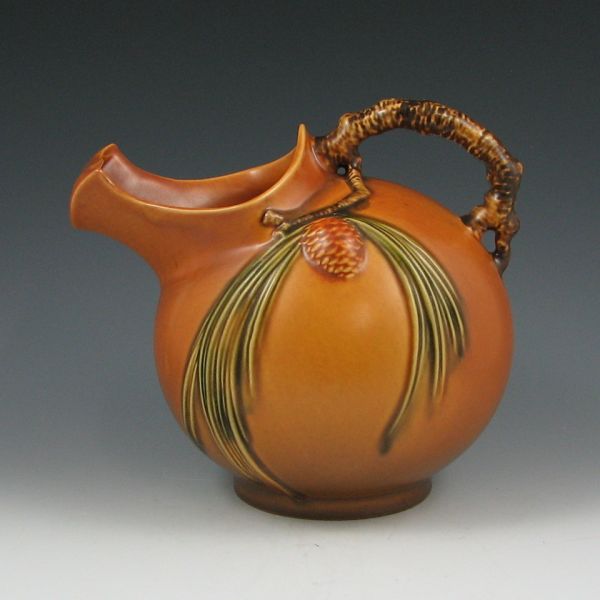 Appraisal: Roseville Pine Cone ice lip pitcher in brown Marked Roseville