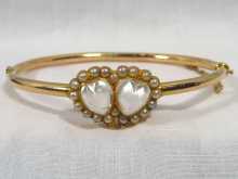 Appraisal: A yellow metal tests carat gold double heart moonstone and