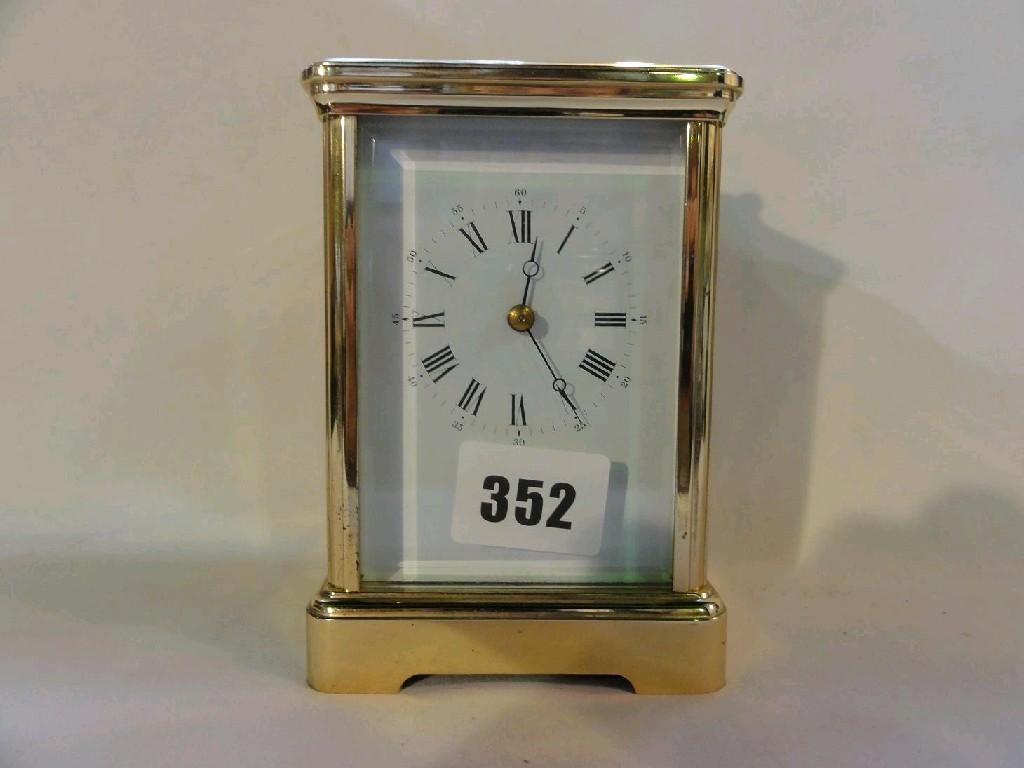 Appraisal: A French brass carriage clock with enamel dial and loop