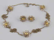 Appraisal: A silver and carat gold necklace and earring set by