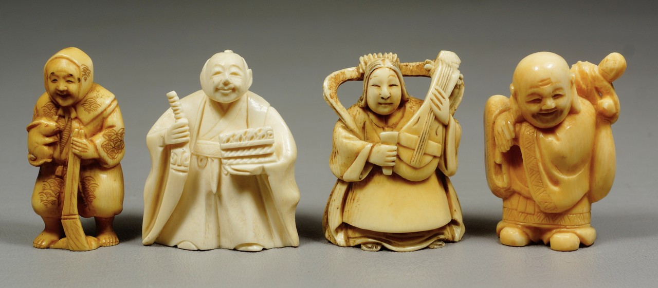 Appraisal: carved ivory figures man with rabbit signed man with carrying