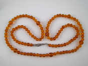 Appraisal: An amber bead necklace largest bead approx mm necklace approx