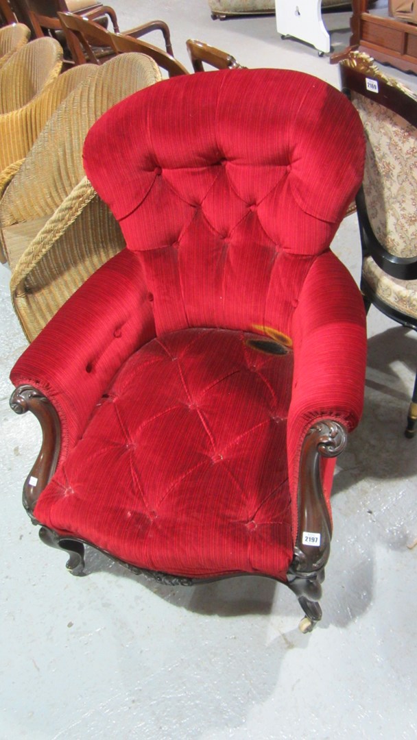 Appraisal: A th century mahogany framed button back armchair