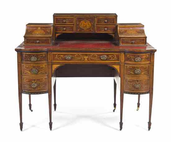 Appraisal: An Edwardian Mahogany Carlton Desk the superstructure centered with a