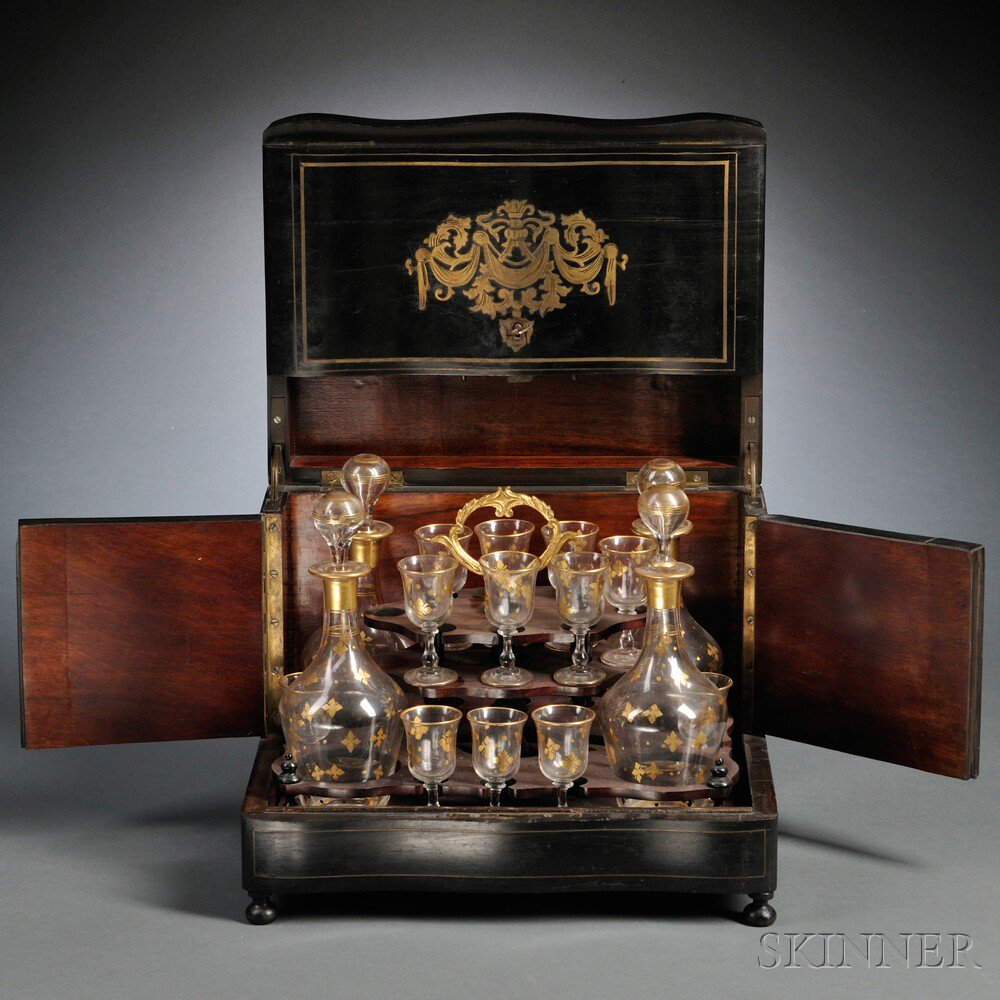 Appraisal: Brass-inlaid Tantalus ebonized case with brass-inlaid pendant swags and scrolls