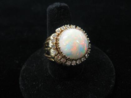 Appraisal: karat yellow gold opal and diamond cluster ring Opal measures