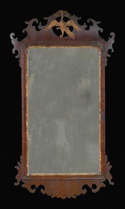 Appraisal: GEORGE III MAHOGANY AND PARCEL GILT MIRROR The gilded phoenix