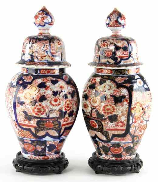 Appraisal: Pair of Imari Porcelain Lidded Mantel Urns th century paneled