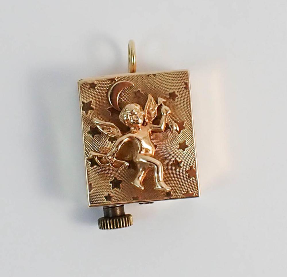 Appraisal: FOURTEEN KARAT GOLD MUSIC BOX PENDANT CHARM the front of