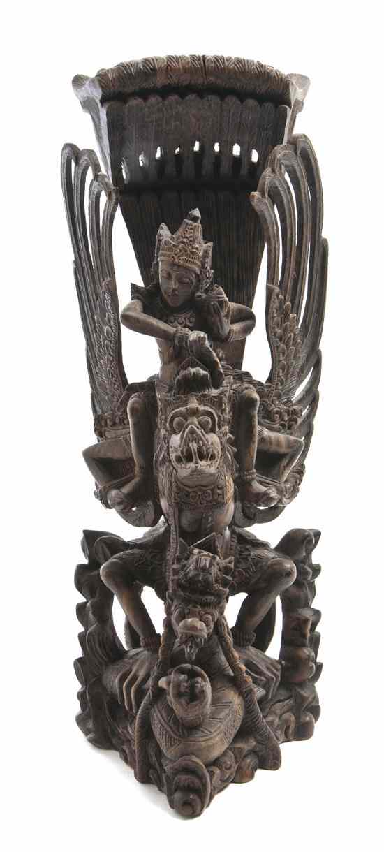 Appraisal: A Balinese Carved Wood Figure of a Beast the crouching