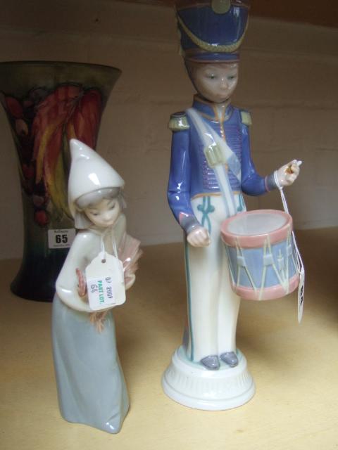 Appraisal: Two Lladro figures a drummer boy and a girl with