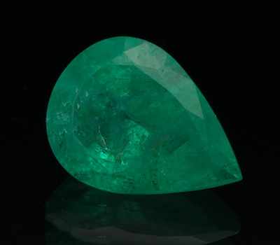 Appraisal: An Unmounted Emerald UGL Report Faceted pear cut weighing carat