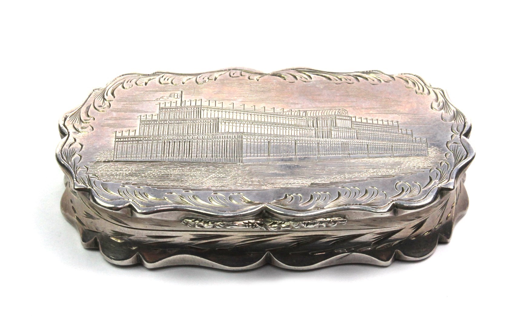 Appraisal: A silver curved rectangular hinge lidded snuff box engraved with