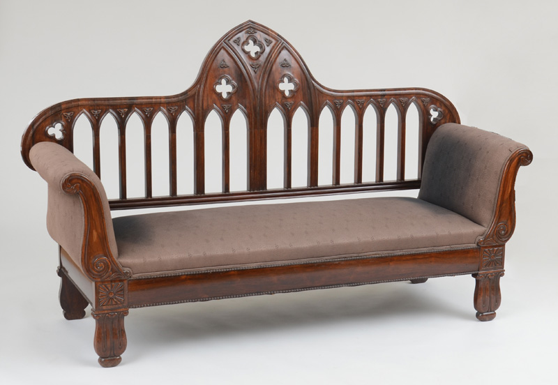 Appraisal: CONTINENTAL NEO-GOTHIC CARVED ROSEWOOD SOFA With an arched top rail