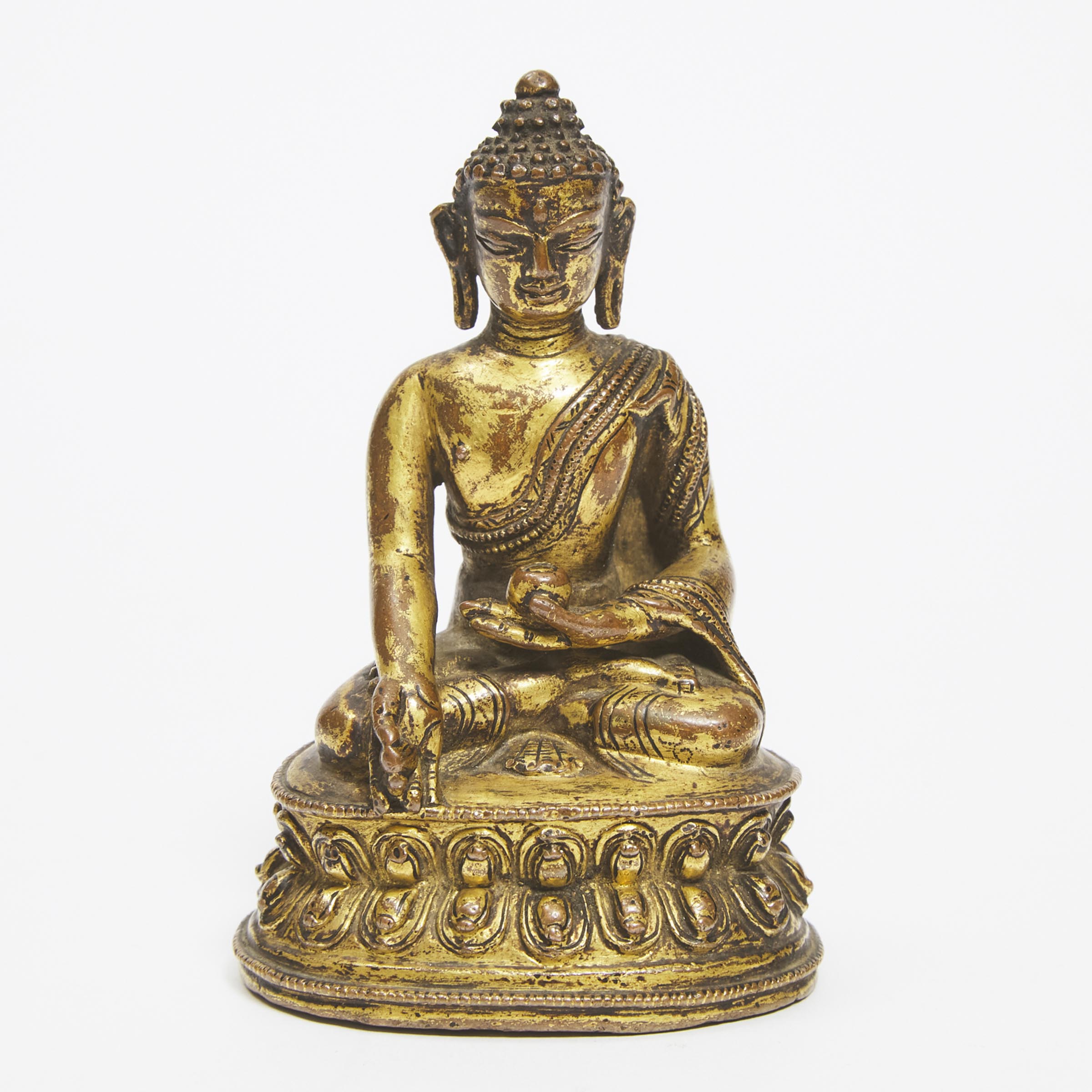 Appraisal: A Gilt Copper Alloy Figure of Medicine Buddha Nepal th