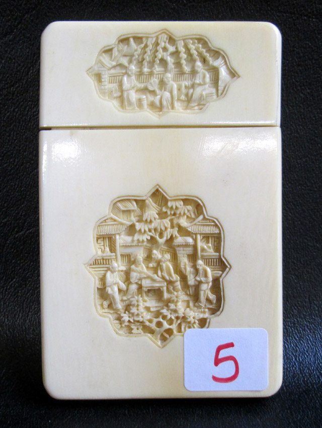 Appraisal: CHINESE CARVED IVORY CARD CASE with intricately carved reserves on