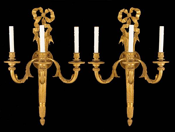 Appraisal: A pair of Louis XVI style gilt bronze three light